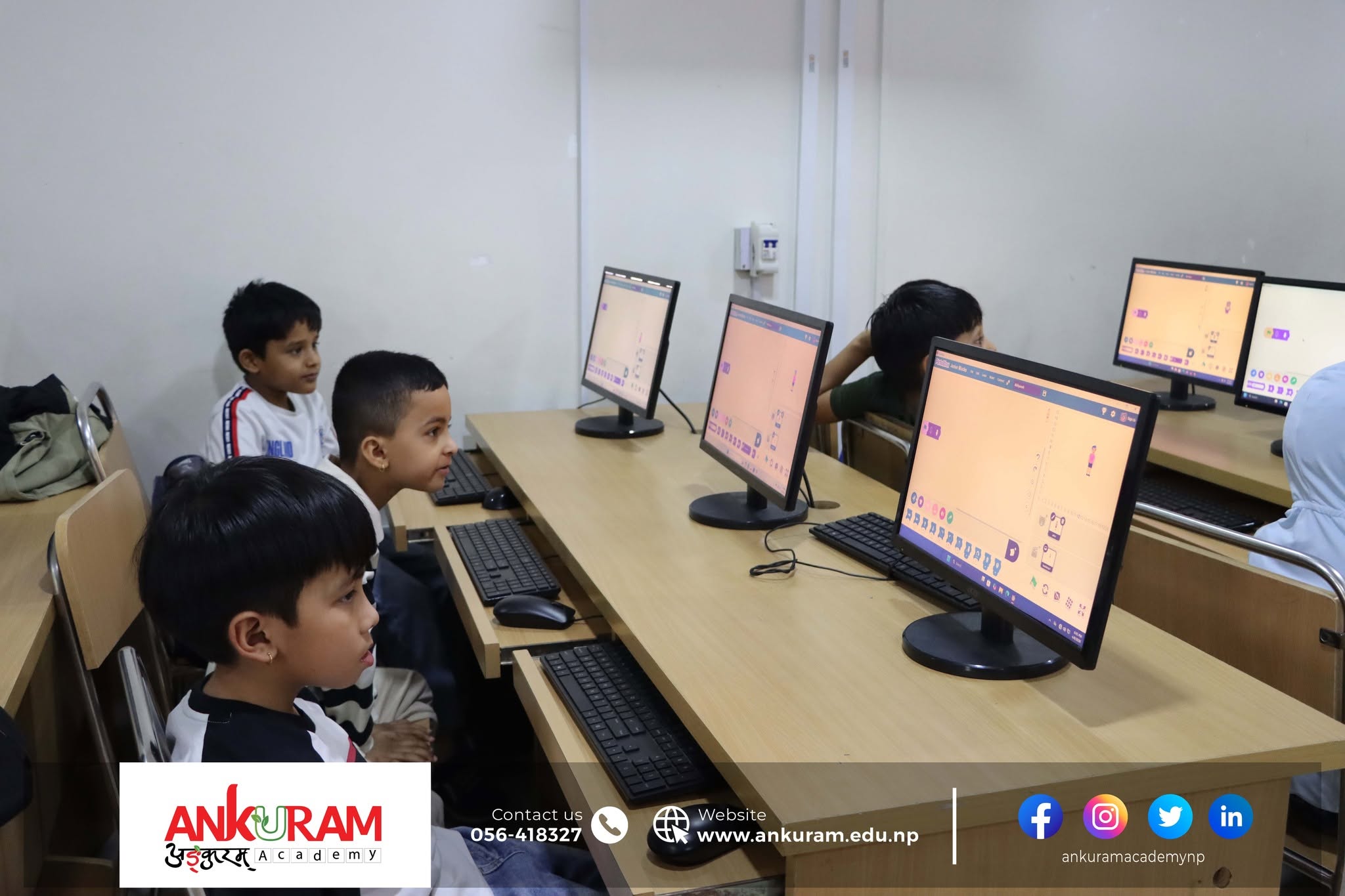 Young students learning coding in a computer lab at Ankuram Academy