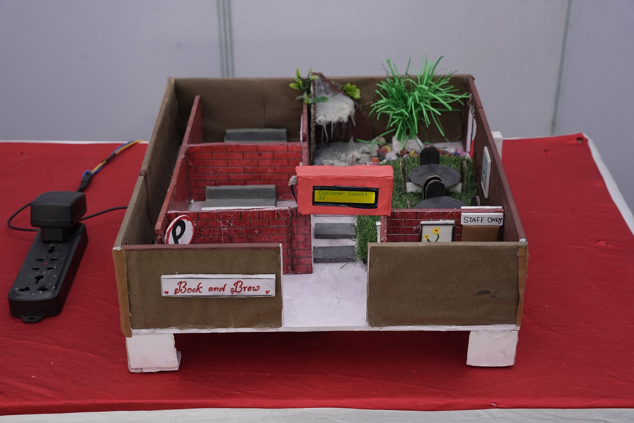 Creative student-built café concept model with digital counter
